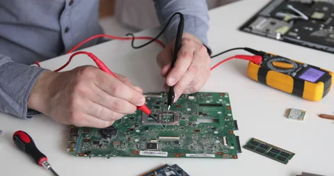 Technician repairing a computer. Work in the service center. Computer repair Stock Footage 153400937