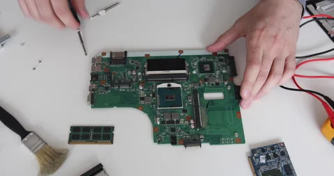 Technician repairing a computer. Work in the service center. Computer repair Stock Footage 153410517