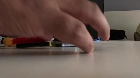 Technician is repairing a computer's hard disk Stock Footage 247817718