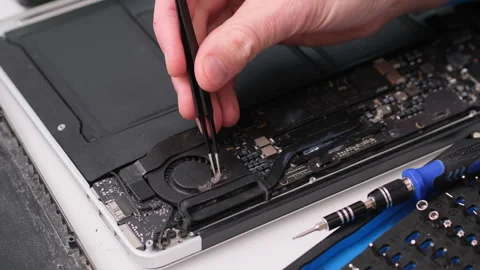 Technician Repairing a Laptop Computer Stock Footage 245203744