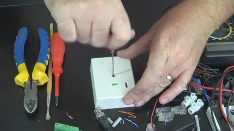 Technician Repairing a Panic Button, Worker on Security System, Electrician Stock Footage 12563953