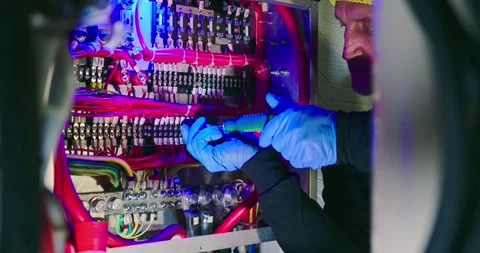Technician Repairs Electrical Panel in Engine Room 스톡 동영상 323748435