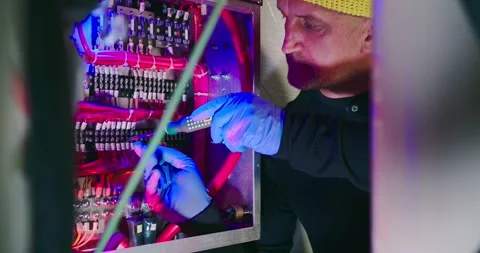 Technician Repairs Electronics in Engine Room Vídeo Stock 323747483