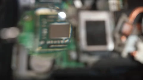 Technician Repairs Laptop Internal Components on Desk, showing components under Vídeo Stock 329582009