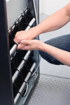 Technician replace battery units on ups Foto stock