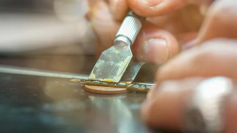 Technician restoring computer connector using special paste in electronics .. Fotos Stock
