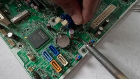 A technician is restoring the computer's processor Stock Footage 247818444