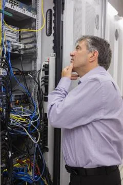 Technician searching for a solution in the server case Fotos Stock