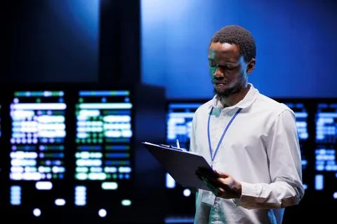 Technician in server annual maintenance Stock Photos