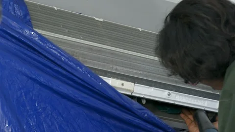 Technician service using electric blowers to dry up and dust cleaning  Stock Footage 120363626