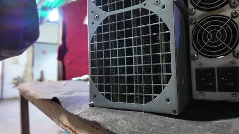 Technician Servicing Electronic Power Supply Unit in Workshop Stock Footage 324935913