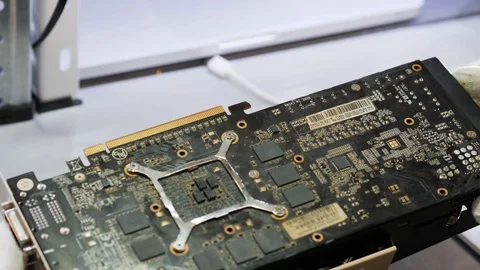 Technician setting a video card to the mother-board of a personal computer Video stock 89900399