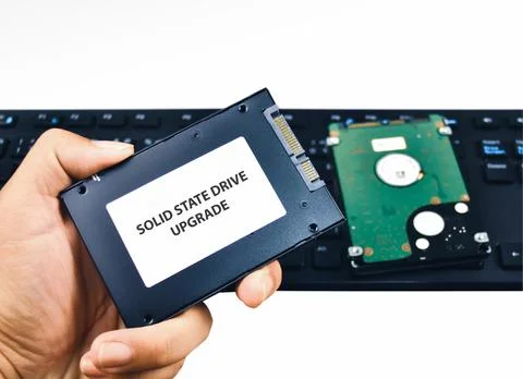 A technician shows a Solid State Drive (SSD) hard disk Stock Photos