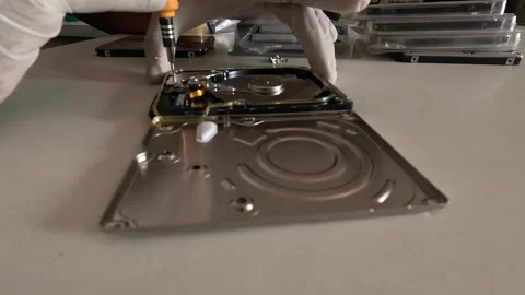 A technician is skillfully repairing a hard disk Stock Footage 247817947