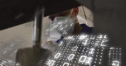 Technician sliding workpiece under hydraulic press, initiating tech binary code Stock Footage 312416846