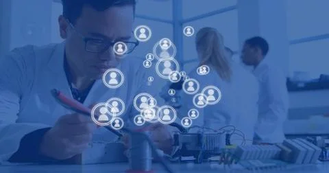 Technician soldering circuit causing animated avatar network mapping team links Stock Photos