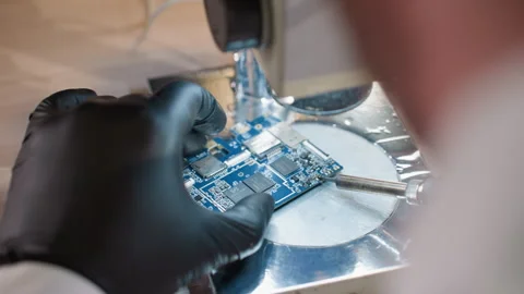Technician Soldering Electronic Circuit Board Under Microscope Stock Footage 285404989