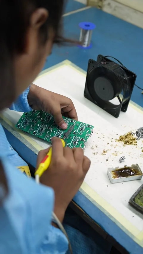Technician Soldering Electronic Circuit Board in Noida Factory Stock Footage 345809244