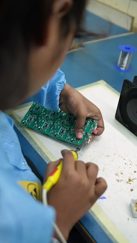 Technician Soldering Electronic Circuit Board in Noida Factory Stock Footage 345809248