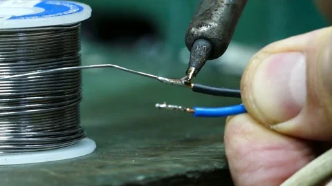 Technician soldering wire, close up of hands Video stock 72943771