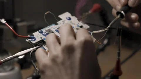 A technician solders an electronic item. Stock Footage 260468355