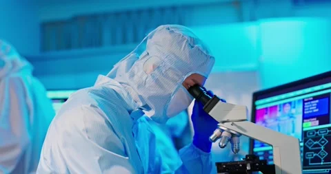 Technician in sterile coverall Video stock 166835387