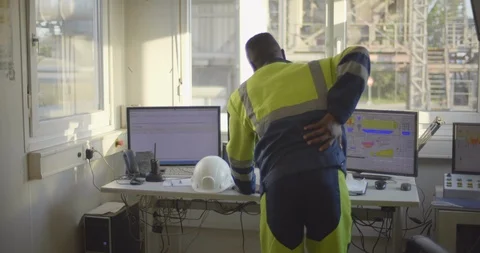 Technician suffering from pain in back Stock Footage 114330730