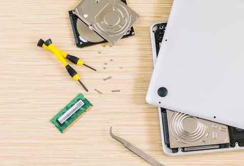 Technician support upgrade part and fixing laptop. Stock Photos
