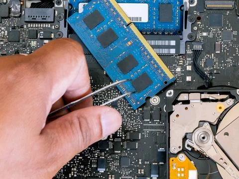 Technician support upgrade part and fixing laptop. Stock Photos