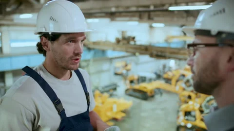 Technician Talking to Engineer during Workday in Industrial Factory Stock Footage 296261902