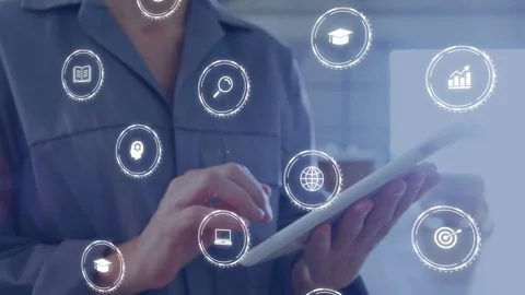 Technician tapping tablet inside factory, activating floating icons and Stock Footage 335255249