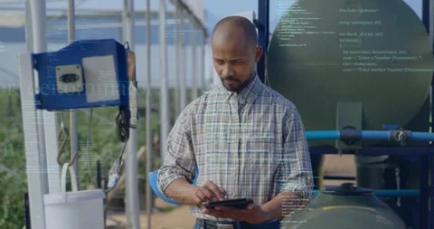 Technician tapping tablet, scanning utility tank checking readings, data overlay Stock Footage 331873009