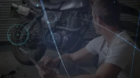 Technician tapping tablet in workshop and generating AR engine diagnostics with Video stock 311586738