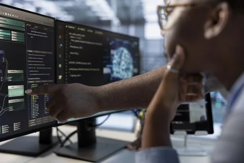 Technician teaches colleague to do data center automation using AI Stock Photos