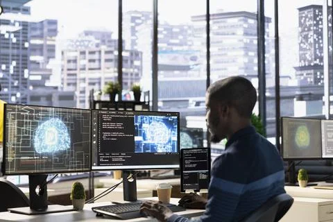Technician testing AI company software, identifying bottlenecks Stock Photos