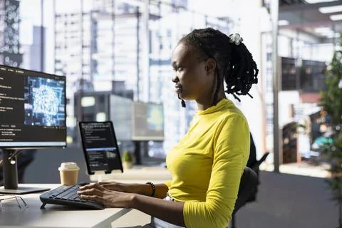 Technician testing AI company software to minimize occurrence of bugs Stock Photos