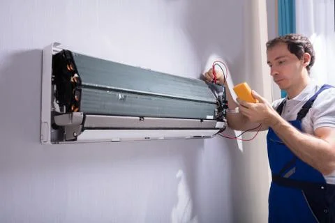 Technician Testing Air Conditioner Stock Photos