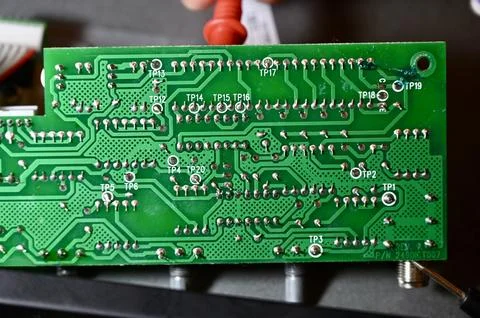 Technician Testing Circuit Board Tracks with Multimeter Probe Close Up Stock Photos