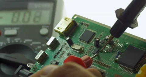 Technician testing mother board with circuit test repairing electronic board Stockbeeldmateriaal 336585414