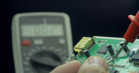 Technician testing mother board with circuit test repairing electronic board Stock Footage 336585461