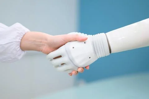 Technician testing robotic bionic arm at prosthetic manufacturing Foto stock