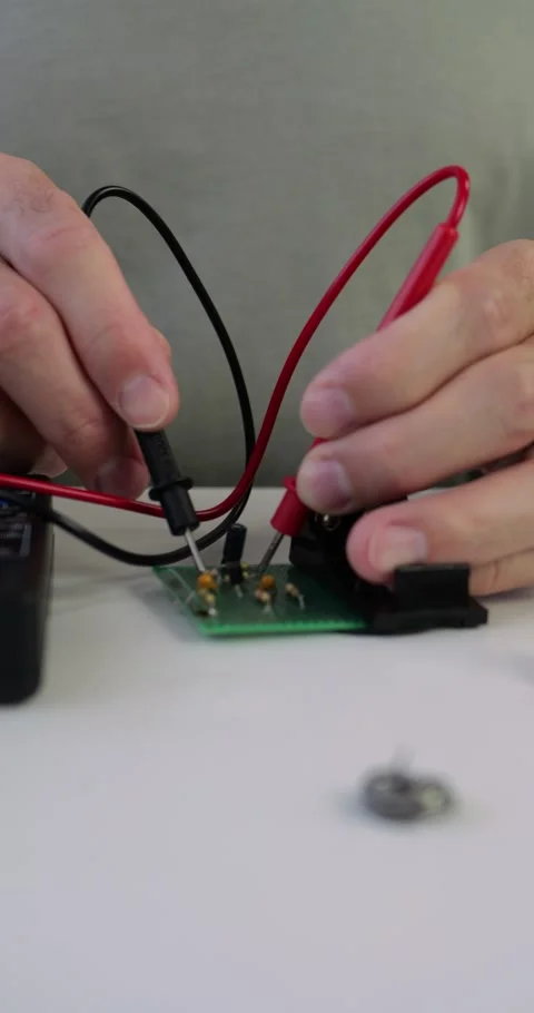 Technician tests electronics in small business workshop close-up. He uses Video stock 329485652