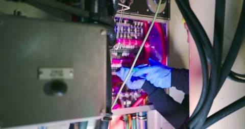 Technician Troubleshooting in Engine Room Stock Footage 323746687