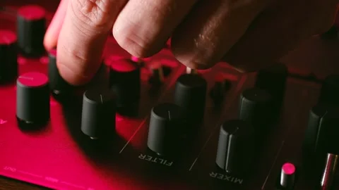 Technician turns knobs on console in music recording studio Video stock 296747399