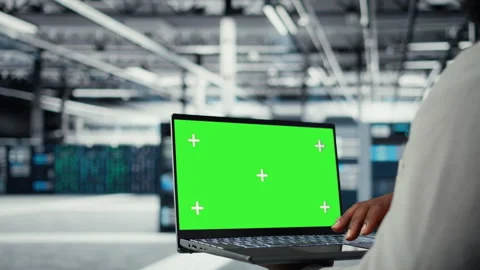 Technician upgrading equipment in data center using isolated screen laptop Stock Footage 311897089