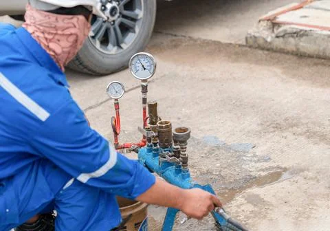 Technician use nitrogen compressor to inspector function safety valve . Stock Photos