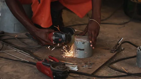 Technician uses grinder Stock Footage 306704441