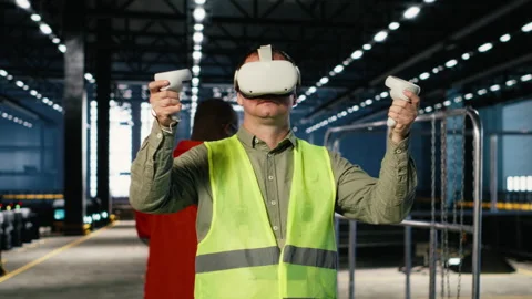 Technician uses virtual reality equipment to review fabrication tasks Stock Footage 322206845