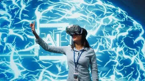Technician uses virtual reality technology to build AI algorithms Stock Photos