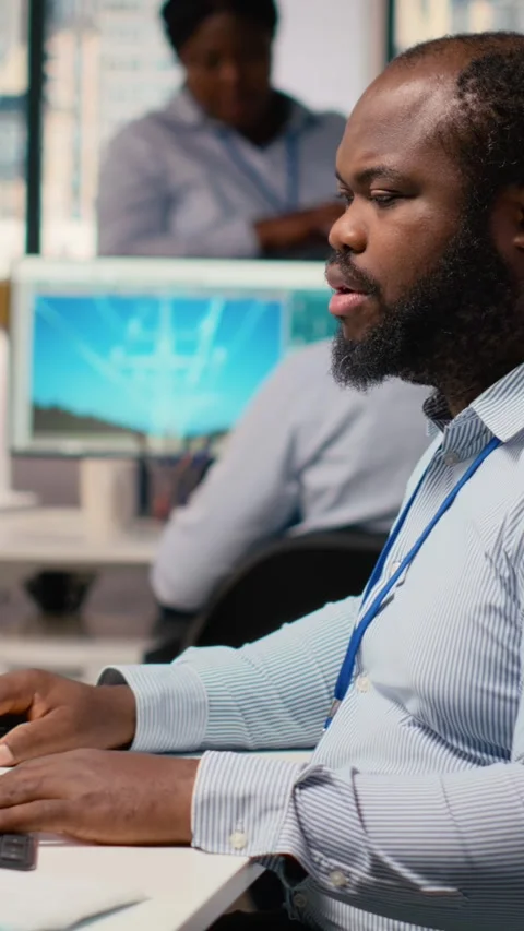 Technician using CAD program on PC to optimize wind turbine design Stock Footage 315415797